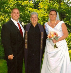 Linda Maxwell with another happy bride and groom